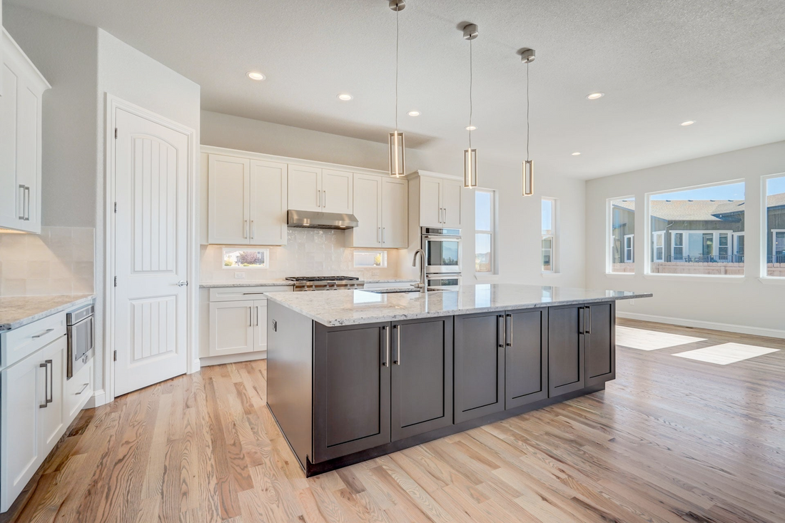 Modern kitchen with waterproof flooring in Colorado Springs home, designed to handle spills, pets, and daily wear.