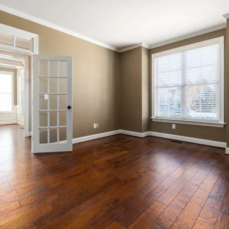 Driftwood style wood flooring in a Colorado Springs home, showing warm tones, natural light, and clean modern interiors.