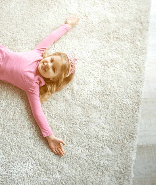 Cute girl laying on rug |  Floor Craft